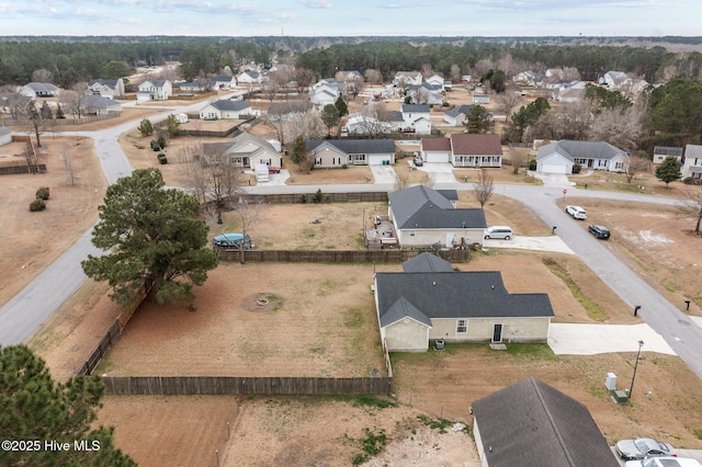 birds eye view of property with a residential view