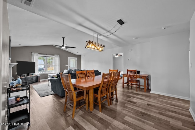 dining room with visible vents, wood finished floors, and a ceiling fan