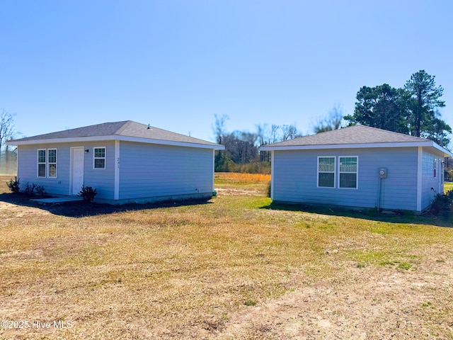 view of side of property featuring a yard