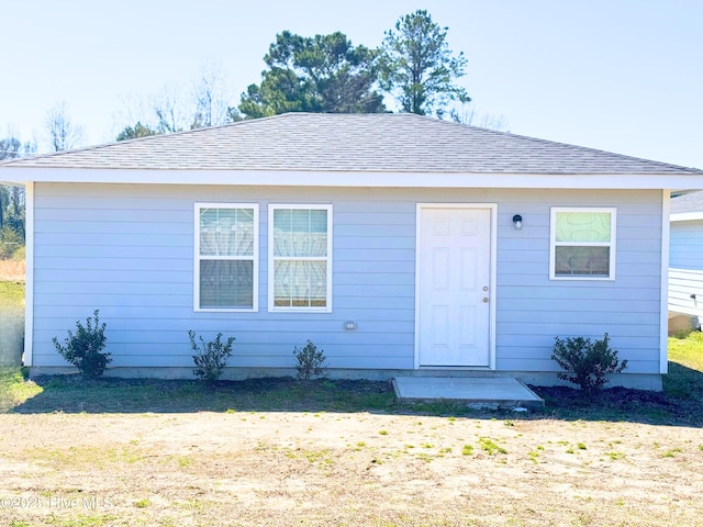 view of front of property with a shingled roof