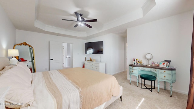 bedroom with crown molding, baseboards, ceiling fan, light colored carpet, and a raised ceiling