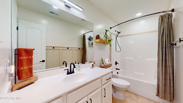 full bathroom featuring visible vents, toilet, shower / bath combo, tile patterned floors, and vanity