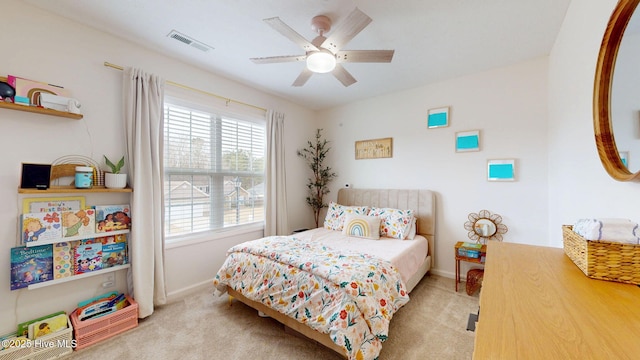 bedroom with visible vents, light carpet, baseboards, and a ceiling fan