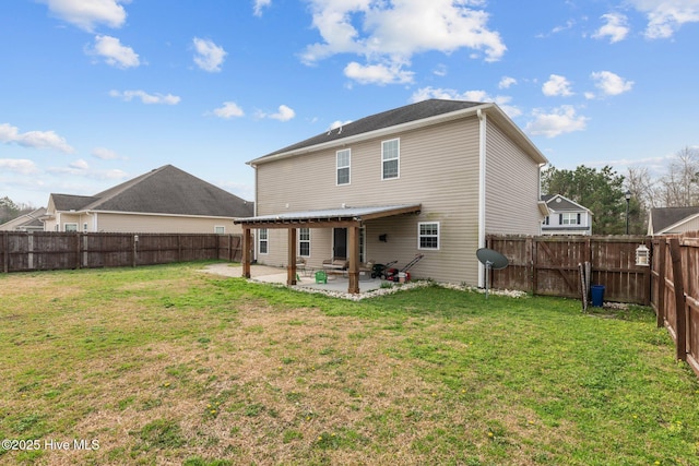 back of property featuring a patio, a yard, and a fenced backyard