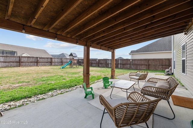 view of patio with a fenced backyard and a playground