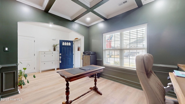 home office with visible vents, arched walkways, coffered ceiling, and beamed ceiling