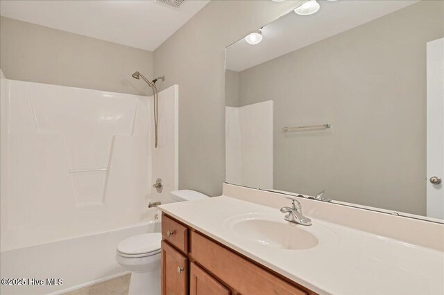 bathroom featuring visible vents, toilet, vanity, and washtub / shower combination