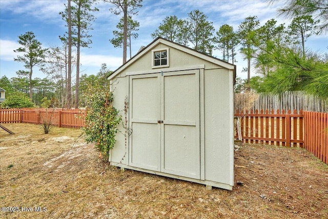 view of shed with a fenced backyard