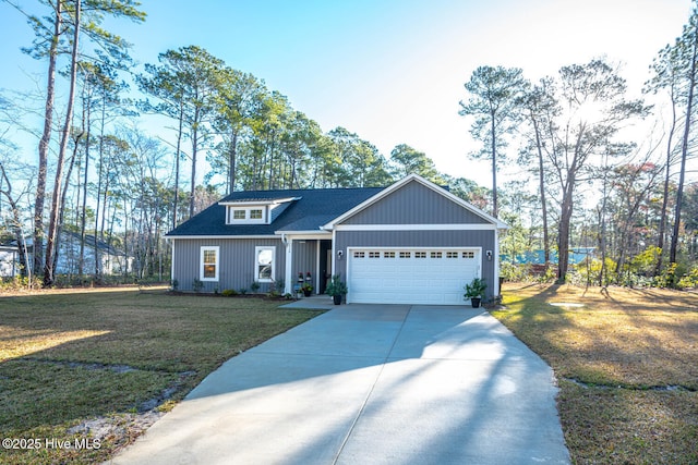 view of front facade featuring a front lawn, an attached garage, driveway, and a shingled roof