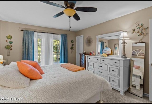 bedroom featuring light carpet and ceiling fan