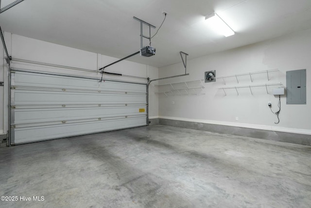 garage with electric panel and a garage door opener