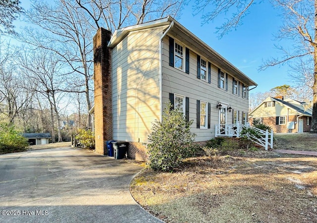 view of front of home with a chimney