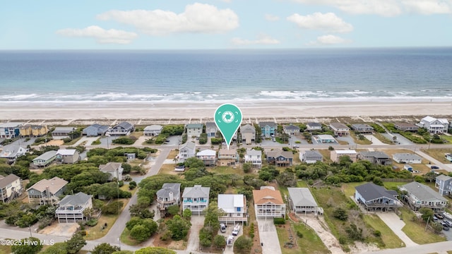 bird's eye view featuring a residential view, a view of the beach, and a water view