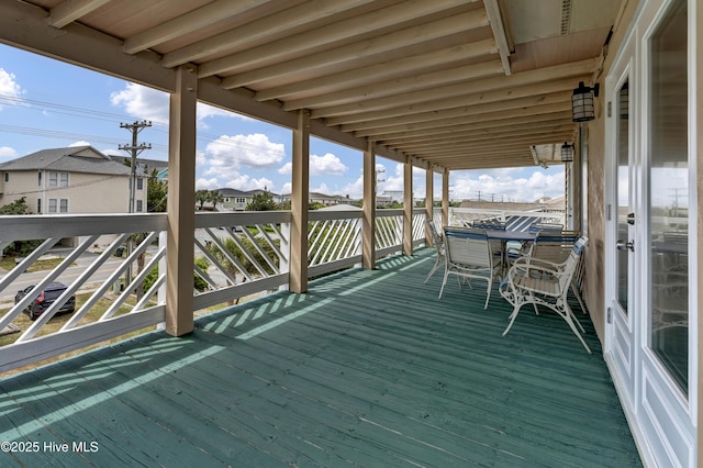 wooden terrace featuring a residential view