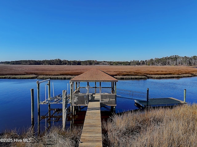 1807 Baywater Ct SE, Bolivia, NC 28422 - view of dock featuring boat lift and a water view