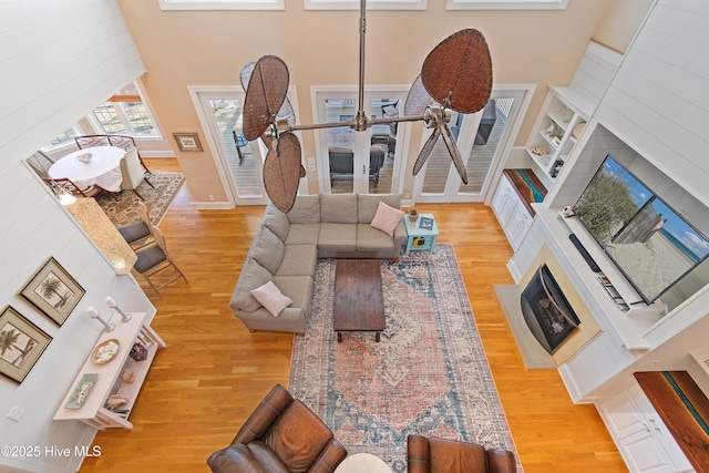 1807 Baywater Ct SE, Bolivia, NC 28422 - living area with wood finished floors, a high ceiling, and built in features