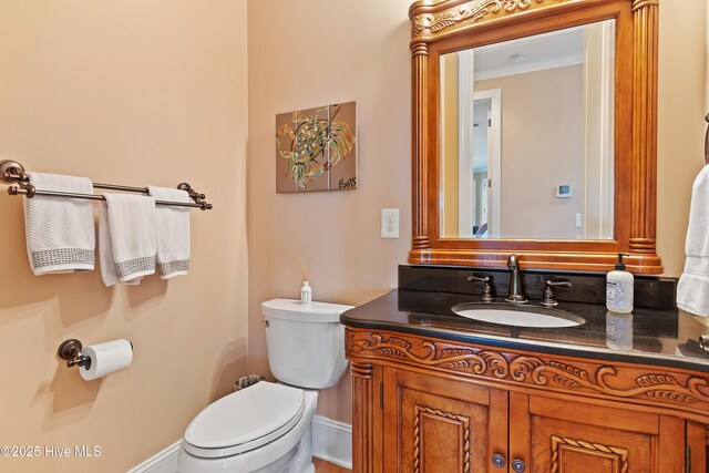 1807 Baywater Ct SE, Bolivia, NC 28422 - bathroom featuring baseboards, toilet, and vanity