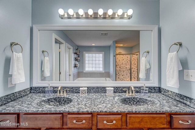 full bath featuring a shower with shower curtain, double vanity, a washtub, and a sink