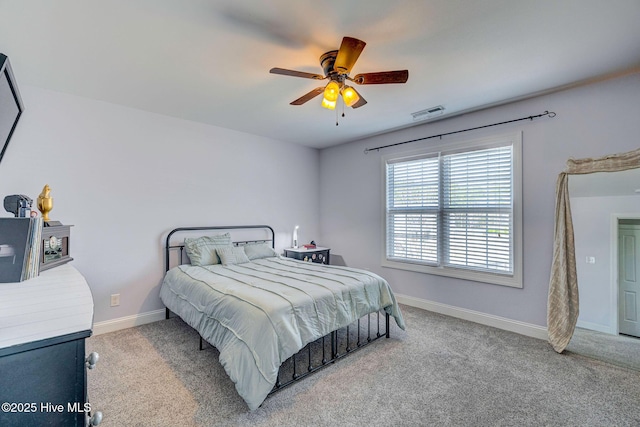 bedroom with visible vents, ceiling fan, baseboards, and carpet