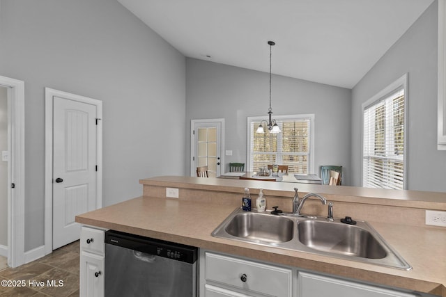 kitchen featuring vaulted ceiling, stainless steel dishwasher, a notable chandelier, white cabinets, and a sink