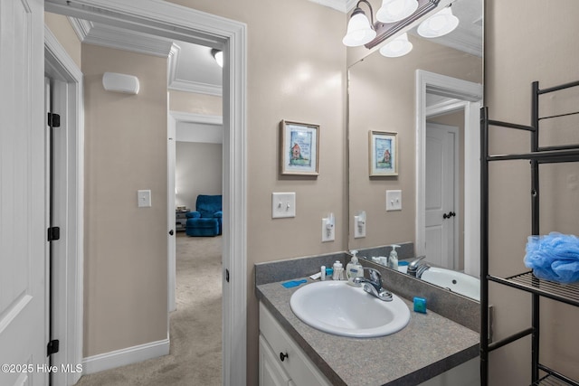 bathroom with baseboards, vanity, an inviting chandelier, and crown molding