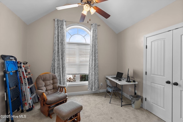 office featuring a ceiling fan, vaulted ceiling, carpet, and baseboards