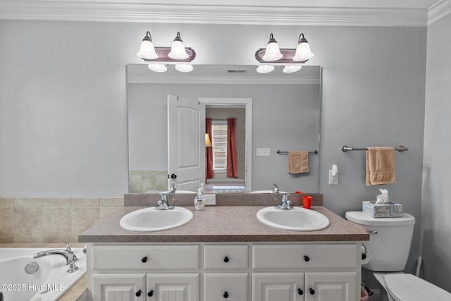 bathroom with toilet, crown molding, a bath, and a sink