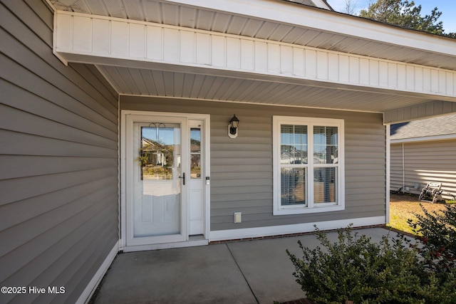 doorway to property featuring covered porch