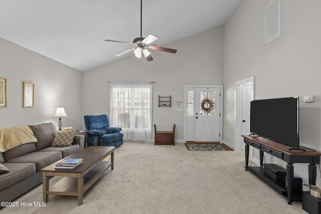 living area with light carpet, visible vents, ceiling fan, and a wealth of natural light