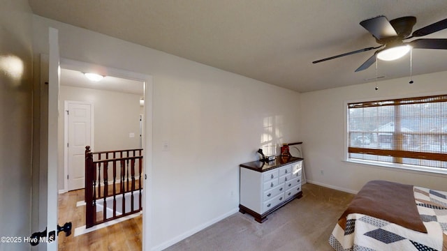 bedroom with light carpet and baseboards