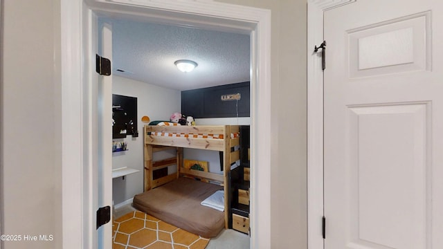 bedroom featuring a textured ceiling