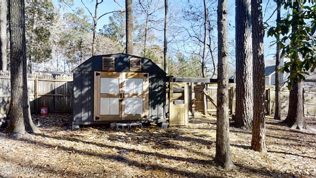 view of shed featuring a fenced backyard