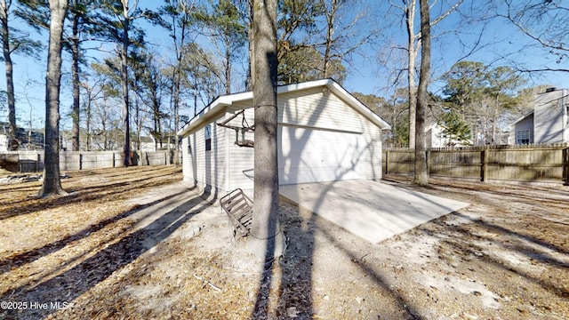 view of outbuilding with fence