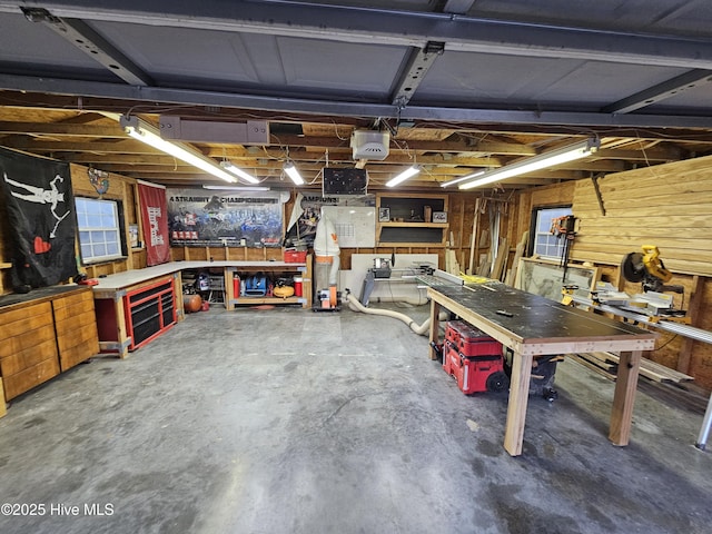 garage featuring a workshop area and a garage door opener