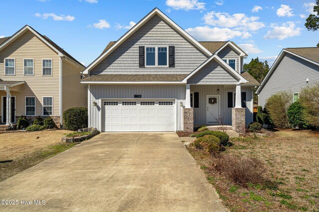 126 Lightwater Dr, Aberdeen, NC 28315 - craftsman-style house with board and batten siding, driveway, roof with shingles, brick siding, and an attached garage