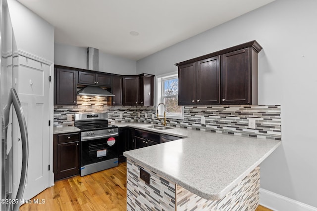 126 Lightwater Dr, Aberdeen, NC 28315 - kitchen with dark brown cabinetry, a sink, stainless steel appliances, backsplash, and under cabinet range hood