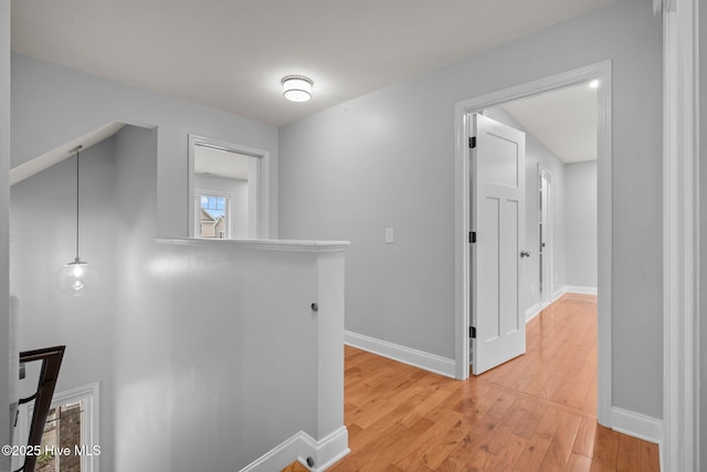 126 Lightwater Dr, Aberdeen, NC 28315 - hallway with baseboards, an upstairs landing, and light wood finished floors
