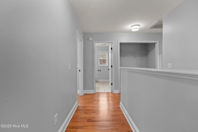 126 Lightwater Dr, Aberdeen, NC 28315 - hallway featuring baseboards, visible vents, and light wood-type flooring