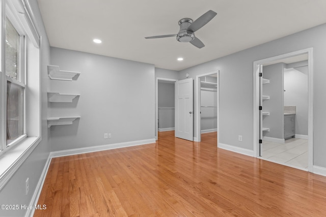 126 Lightwater Dr, Aberdeen, NC 28315 - unfurnished bedroom with recessed lighting, baseboards, a spacious closet, and wood finished floors