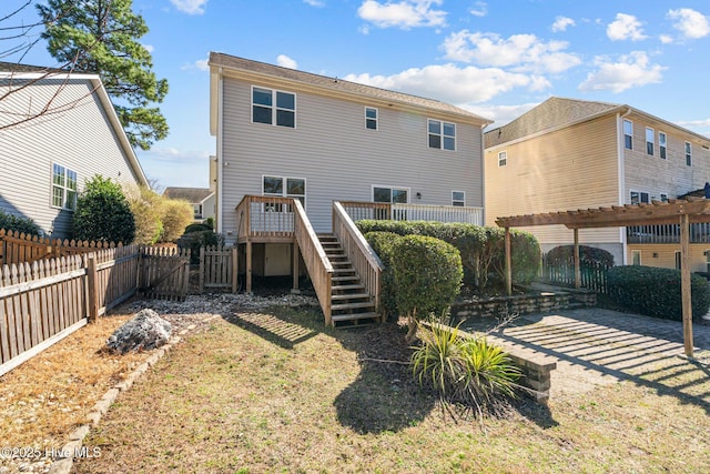 126 Lightwater Dr, Aberdeen, NC 28315 - rear view of house with a fenced backyard, a gate, a wooden deck, and stairs