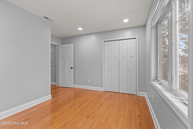 126 Lightwater Dr, Aberdeen, NC 28315 - unfurnished bedroom featuring baseboards, visible vents, and multiple windows