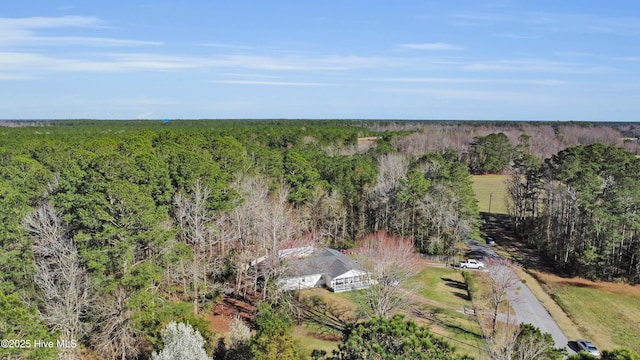 drone / aerial view with a view of trees