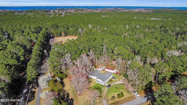 drone / aerial view featuring a view of trees