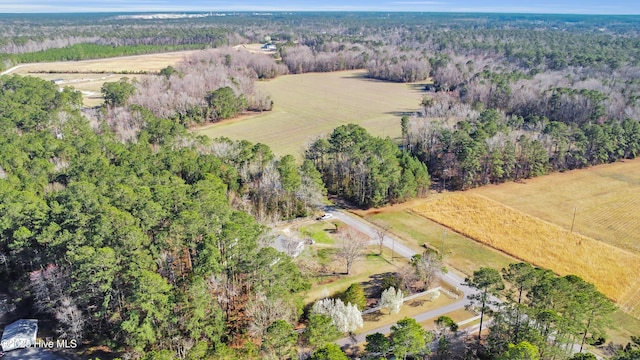 aerial view with a rural view and a wooded view