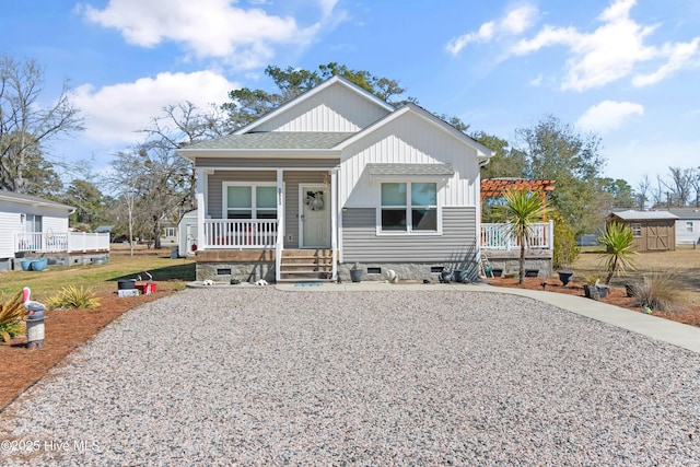 bungalow-style house featuring a front lawn, a pergola, a porch, roof with shingles, and crawl space