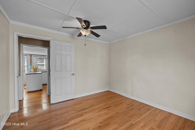 209 N 8th St, Morehead City, NC 28557 - spare room featuring a ceiling fan, light wood finished floors, baseboards, and ornamental molding
