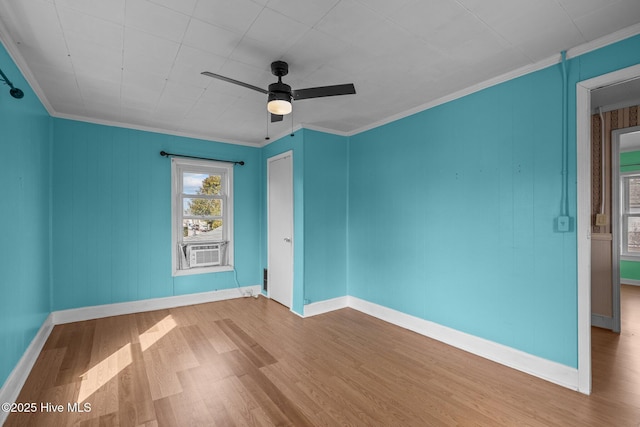 209 N 8th St, Morehead City, NC 28557 - unfurnished room featuring wood finished floors, a ceiling fan, baseboards, crown molding, and cooling unit