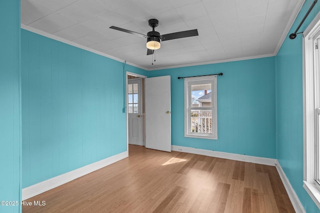 209 N 8th St, Morehead City, NC 28557 - spare room featuring wood finished floors, baseboards, ceiling fan, and crown molding