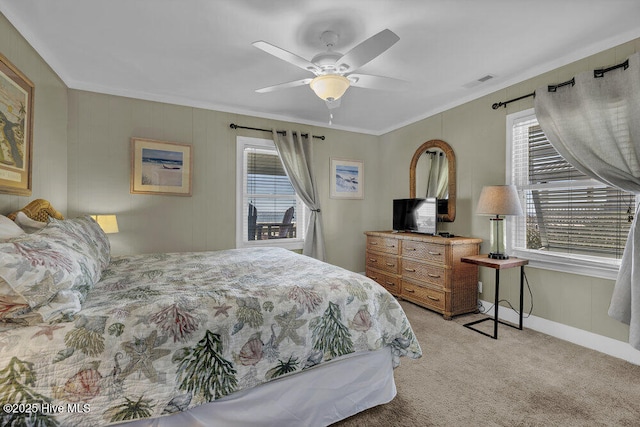 bedroom featuring baseboards, visible vents, ceiling fan, light carpet, and crown molding