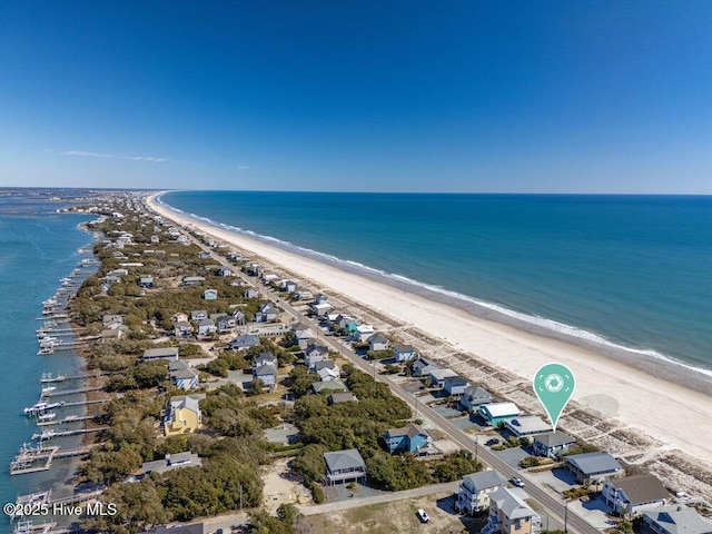 drone / aerial view with a water view and a view of the beach